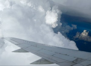 Clouds and wing viewed from an aircraft window
